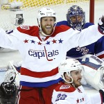 
              Washington Capitals center Brooks Laich (21) and left wing Curtis Glencross (22) celebrate a third period goal by Glencross against New York Rangers goalie Henrik Lundqvist during Game 5 in the second round of the NHL Stanley Cup hockey playoffs, Friday, May 8, 2015, in New York. (AP Photo/Julie Jacobson)
            