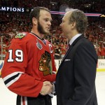 
              Tampa Bay Lightning head coach Jon Cooper, right, congratulates Chicago Blackhawks center Jonathan Toews (19) after Game 6 of the NHL hockey Stanley Cup Final series on Monday, June 15, 2015, in Chicago. The Blackhawks defeated the Lightning 2-0 to win the series 4-2. (AP Photo/Nam Y. Huh)
            