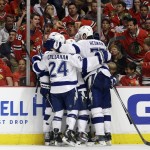 
              Teammates congratulate Tampa Bay Lightning's Cedric Paquette on his goal during the third period in Game 3 of the NHL hockey Stanley Cup Final against the Chicago Blackhawks on Monday, June 8, 2015, in Chicago. The Lightning won 3-2. (AP Photo/Nam Y. Huh)
            