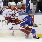 
              Washington Capitals center Nicklas Backstrom (19) and New York Rangers right wing Martin St. Louis (26) look down ice after a pass during the first period of Game 1 in the second round of the NHL Stanley Cup hockey playoffs, Thursday, April 30, 2015, in New York. (AP Photo/Frank Franklin II)
            