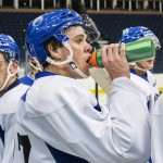 
              Connor McDavid, centre, takes a drink as he attends the Edmonton Oilers' orientation camp Wednesday, July 1, 2015, in Edmonton, Alberta, Canada. McDavid was the top pick in the recent NHL hockey draft. (John Ulan/The Canadian Press via AP0
            