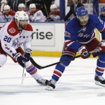 
              Washington Capitals right wing Troy Brouwer (20) watches as New York Rangers defenseman Dan Boyle (22) reacts as his pass is blocked during the second period of Game 5 in the second round of the NHL Stanley Cup hockey playoffs, Friday, May 8, 2015, in New York. (AP Photo/Kathy Willens)
            