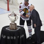 
              Bill L. Daly, right, National Hockey League's Deputy Commissioner, greets Chicago Blackhawks center Jonathan Toews after their win against the Anaheim Ducks in Game 7 of the Western Conference final of the NHL hockey Stanley Cup playoffs in Anaheim, Calif., Saturday, May 30, 2015.  (AP Photo/Mark J. Terrill)
            