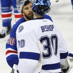 
              New York Rangers goalie Henrik Lundqvist (30) congratulates Tampa Bay Lightning goalie Ben Bishop (30) after the Lightning beat the Rangers 2-0 in Game 7 of the Eastern Conference final during the NHL hockey Stanley Cup playoffs, Friday, May 29, 2015, in New York. (AP Photo/Kathy Willens)
            