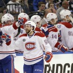 
              Montreal Canadiens center David Desharnais, foreground, is congratulated by teammates after he scored a goal during second period of Game 4 NHL second round playoff hockey action against the Tampa Bay Lightning, Thursday, May 7, 2015, in Tampa, Fla. (AP Photo/Wilfredo Lee)
            