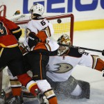 
              Anaheim Ducks goalie Frederik Andersen, second from right, from Denmark, lets in a goal from Calgary Flames' Sean Monahan, left, during the first period of Game 4 of NHL hockey second-round playoff action in Calgary, Alberta, Friday, May 8, 2015. (Jeff McIntosh/The Canadian Press via AP) MANDATORY CREDIT
            