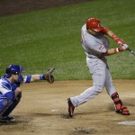 
              Cincinnati Reds' Eugenio Suarez hits a two-run home run against the Chicago Cubs during the sixth inning of a baseball game Saturday, June 13, 2015, in Chicago. (AP Photo/Nam Y. Huh)
            