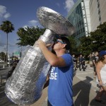 
              Josh Hogan kisses a replica Stanley Cup he made out of tin foil outside Amalie Arena before the start of Game 5 of the NHL hockey Stanley Cup Final between the Chicago Blackhawks and the Tampa Bay Lightning, Saturday, June 13, 2015, in Tampa, Fla. (AP Photo/John Raoux)
            