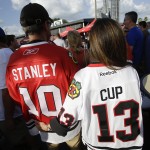 
              Chicago Blackhawks fans Tim, left, and Dawn Kroll walk around Amalie Arena before the start of Game 5 of the NHL hockey Stanley Cup Final between the Blackhawks and the Tampa Bay Lightning, Saturday, June 13, 2015, in Tampa, Fla. (AP Photo/John Raoux)
            