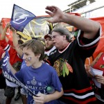 
              Tampa Bay Lightning and Chicago Blackhawks fans cheer for a television camera before the start of Game 5 of the NHL hockey Stanley Cup Final, Saturday, June 13, 2015, in Tampa, Fla. (AP Photo/John Raoux)
            
