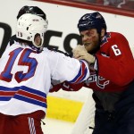 
              New York Rangers left wing Tanner Glass (15) fights with Washington Capitals defenseman Tim Gleason (6) during the third period of Game 4 in the second round of the NHL Stanley Cup hockey playoffs, Wednesday, May 6, 2015, in Washington. The Capitals won 2-1. (AP Photo/Alex Brandon)
            
