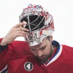 
              Montreal Canadiens goaltender Carey Price removes his helmet during third period against the Ottawa Senators in Game 5 of a first-round NHL hockey playoff series, Friday, April 24, 2015, in Montreal. (Graham Hughes/The Canadian Press via AP)
            