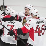 
              Ottawa Senators' Erik Karlsson, second from left, celebrates with teammates Milan Michalek (9), Kyle Turris (7), Patrick Wiercioch (46) and Mark Stone (61) after scoring against the Montreal Canadiens during the second period of Game 5 of a first-round NHL hockey playoff series, Friday, April 24, 2015, in Montreal. (Graham Hughes/The Canadian Press via AP)
            