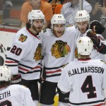 
              Members of the Chicago Blackhawks celebrate center Jonathan Toews's (19) goal against the Anaheim Ducks during the first period in Game 7 of the Western Conference final of the NHL hockey Stanley Cup playoffs in Anaheim, Calif., Saturday, May 30, 2015.  (AP Photo/Mark J. Terrill)
            