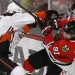 
              Anaheim Ducks defenseman Clayton Stoner, left, checks Chicago Blackhawks center Brad Richards (91) during the second period in Game 4 of the Western Conference finals of the NHL hockey Stanley Cup playoffs, Saturday, May 23, 2015, in Chicago. (AP Photo/Charles Rex Arbogast)
            