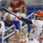 
              St. Louis Cardinals' Jason Heyward hits a home run scoring Mark Reynolds and Jhonny Peralta  during the seventh inning of a baseball game against the Miami Marlins, Wednesday, June 24, 2015, in Miami. (AP Photo/Wilfredo Lee)
            