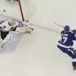 
              Tampa Bay Lightning center Alex Killorn (17) , right, scores a goal past Chicago Blackhawks goalie Corey Crawford (50) during the first period in Game 1 of the NHL hockey Stanley Cup Final in Tampa, Fla., Wednesday, June 3, 2015.  (AP Photo/Chris O'Meara)
            