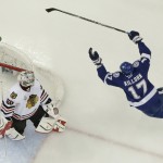 
              Tampa Bay Lightning center Alex Killorn (17), right, celebrates after scoring past Chicago Blackhawks goalie Corey Crawford (50) during the first period in Game 1 of the NHL hockey Stanley Cup Final in Tampa, Fla., Wednesday, June 3, 2015.  (AP Photo/Chris O'Meara)
            