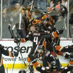 
              corrects name of the photographerAnaheim Ducks' Corey Perry (10), rear left, celebrates his game-winning goal for a 3-2 overtime win against Calgary in Game 5 of a second-round series in the NHL hockey playoffs in Anaheim, Calif., Sunday, May 10, 2015.  Anaheim eliminated Calgary and will face the Chicago Blackhawks in the Western Conference finals. (Kyusung Gong/The Orange County Register via AP) LA TIMES OUT MAGS
            