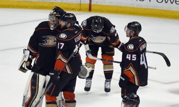 Members of the Anaheim Ducks react to their loss against the Chicago Blackhawks in Game 7 of the We...