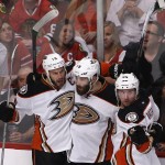 
              Anaheim Ducks left wing Patrick Maroon (19) celebrates his goal against against the Chicago Blackhawks with center Ryan Getzlaf (15) and defenseman Sami Vatanen (45) during the second period in Game 6 of the Western Conference finals of the NHL hockey Stanley Cup playoffs, Wednesday, May 27, 2015, in Chicago. (AP Photo/Charles Rex Arbogast)
            