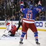 
              New York Rangers left wing Rick Nash (61) reacts after a goal by right wing Kevin Hayes (13) against Washington Capitals goalie Braden Holtby (70) during the second period of Game 7 of the Eastern Conference semifinals during the NHL hockey Stanley Cup playoffs, Wednesday, May 13, 2015, in New York. (AP Photo/Kathy Willens)
            
