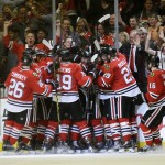 
              Chicago Blackhawks players celebrate Antoine Vermette's goal against the Anaheim Ducks during the second overtime in Game 4 of the Western Conference finals of the NHL hockey Stanley Cup Playoffs, Saturday, May 23, 2015, in Chicago. The Blackhawks won 5-4. (AP Photo/Nam Y. Huh)
            