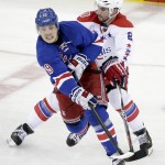 
              New York Rangers right wing Jesper Fast (19) passes off the puck against Washington Capitals defenseman Matt Niskanen (2) during the third period of Game 7 of the Eastern Conference semifinals during the NHL hockey Stanley Cup playoffs Wednesday, May 13, 2015, in New York. (AP Photo/Frank Franklin II)
            