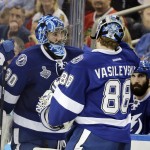 
              Tampa Bay Lightning goalie Ben Bishop, left, is replaced by goalie Andrei Vasilevskiy during the third period in Game 2 of the NHL hockey Stanley Cup Final against the Chicago Blackhawks in Tampa, Fla., Saturday, June 6, 2015.  (AP Photo/Chris O'Meara)
            