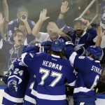 
              Members of the Tampa Bay Lightning celebrate after center Cedric Paquette's goal during the first period in Game 2 of the NHL hockey Stanley Cup Final against the Chicago Blackhawks on Saturday, June 6, 2015, in Tampa Fla. (AP Photo/John Raoux)
            