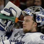 
              Tampa Bay Lightning goalie Andrei Vasilevskiy sprays his face during the second period in Game 4 of the NHL hockey Stanley Cup Final against the Chicago Blackhawks Wednesday, June 10, 2015, in Chicago. (AP Photo/Nam Y. Huh)
            