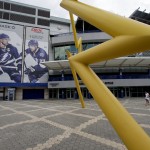 
              Fans walk outside Amalie Arena, home of the Tampa Bay Lightning, Friday, June 5, 2015, in Tampa, Fla. While Sun Belt NHL teams from Phoenix to Miami struggle to maintain revenue and relevance in their communities, the Tampa Bay Lightning are thriving. The franchise’s second trip to the Stanley Cup Final is the highlight of a revival under owner Jeff Vinik as the organization builds a vibrant hockey town in a warm-weather climate. Game 2 is scheduled for Saturday night against the Chicago Blackhawks. (AP Photo/Chris Carlson)
            
