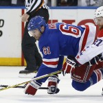 
              New York Rangers left wing Rick Nash (61) and Washington Capitals defenseman Karl Alzner (27) hit the ice as they vie for the puck during the third period of Game 7 of the Eastern Conference semifinals during the NHL hockey Stanley Cup playoffs, Wednesday, May 13, 2015, in New York. (AP Photo/Kathy Willens)
            