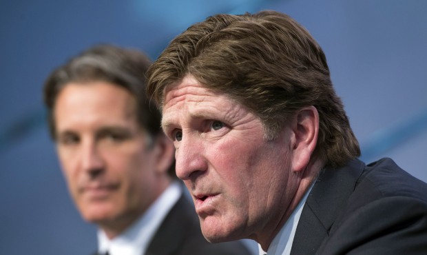 Toronto Maple Leafs new head coach Mike Babcock, right, speaks to reporters with team president Bre...