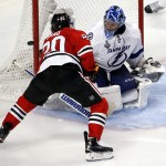 
              Chicago Blackhawks' Brandon Saad, right, shoots wide of Tampa Bay Lightning goalie Ben Bishop during the third period in Game 3 of the NHL hockey Stanley Cup Final on Monday, June 8, 2015, in Chicago. (AP Photo/Charles Rex Arbogast)
            