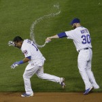 
              Chicago Cubs' Starlin Castro, left, and Jason Motte celebrate after Castro hit the game-winning single during the ninth inning of a baseball game against the Cincinnati Reds on Saturday, June 13, 2015, in Chicago. The Cubs won 4-3. (AP Photo/Nam Y. Huh)
            