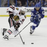 
              Tampa Bay Lightning right wing J.T. Brown (23) right, battles Chicago Blackhawks defenseman Johnny Oduya (27) for the puck, during the first period in Game 1 of the NHL hockey Stanley Cup Final in Tampa, Fla., Wednesday, June 3, 2015.  (AP Photo/Chris O'Meara)
            