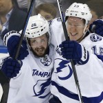 
              Tampa Bay Lightning right wing Nikita Kucherov (86) and left wing Ondrej Palat (18) celebrate Palat's third period goal against the New York Rangers during Game 7 of the Eastern Conference final during the NHL hockey Stanley Cup playoffs, Friday, May 29, 2015, in New York. (AP Photo/Kathy Willens)
            