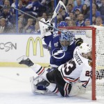 
              Chicago Blackhawks right wing Kris Versteeg (23) of Canada, collides with Tampa Bay Lightning goalie Ben Bishop (30) during the second period in Game 1 of the NHL hockey Stanley Cup Final in Tampa, Fla., Wednesday, June 3, 2015.  (AP Photo/Chris O' Meara)
            