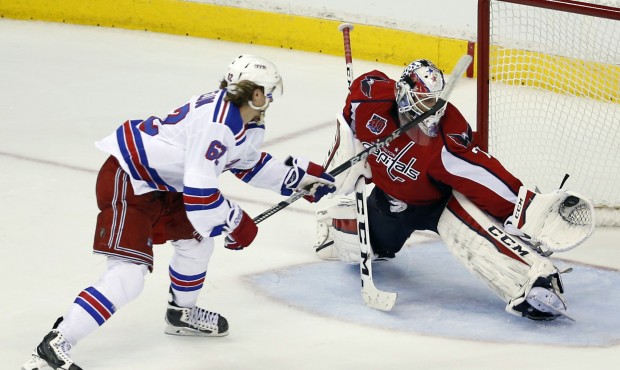 A penalty shot by New York Rangers left wing Carl Hagelin (62), from Sweden, is caught by Washingto...