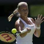 
              Kiki Bertens of the Netherlands plays a return to Petra Kvitova of the Czech Republic during their singles first round match at the All England Lawn Tennis Championships in Wimbledon, London, Tuesday June 30, 2015. (AP Photo/Tim Ireland)
            