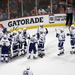 
              Members of the Tampa Bay Lightning celebrate their 3-2 victory over the Chicago Blackhawks in Game 3 of the NHL hockey Stanley Cup Final on Monday, June 8, 2015, in Chicago. The Lightning have taken a 2-1 lead in the series.(AP Photo/Charles Rex Arbogast)
            