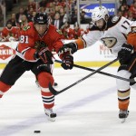 
              Chicago Blackhawks right wing Marian Hossa (81) and Anaheim Ducks center Ryan Kesler (17) vie for the puck during the second period in Game 4 of the Western Conference finals of the NHL hockey Stanley Cup playoffs, Saturday, May 23, 2015, in Chicago. (AP Photo/Nam Y. Huh)
            