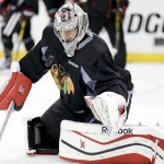 
              Chicago Blackhawks goalie Corey Crawford blocks a shot during practice at the NHL hockey Stanley Cup Final, Friday, June 5, 2015, in Tampa, Fla. The Chicago Blackhawks lead the best-of-seven games series against the Tampa Bay Lightning 1-0. Game 2 is scheduled for Saturday night. (AP Photo/Chris Carlson)
            