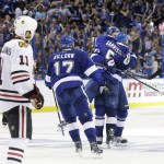 
              Tampa Bay Lightning defenseman Victor Hedman (77) hugs defenseman Jason Garrison (5) after Garrison scored to take the lead, 4-3, in the third period of of Game 2 of the Stanley Cup Finals against the  Chicago Blackhawks at Amalie Arena in Tampa, Fla., Saturday, June 6, 2015. At left is Blackhawks' Andrew Desjardins.  Tampa defeated Chicago 4-3.   (Dirk Shadd/The Tampa Bay Times via AP)  TAMPA OUT; CITRUS COUNTY OUT; PORT CHARLOTTE OUT; BROOKSVILLE HERNANDO TODAY OUT
            