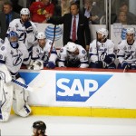 
              Tampa Bay Lightning goalie Ben Bishop (30) stands with his teammates during a timeout in the third period in Game 6 of the NHL hockey Stanley Cup Final series against the Chicago Blackhawks on Monday, June 15, 2015, in Chicago. (AP Photo/Charles Rex Arbogast)
            