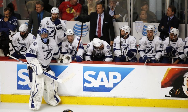 Tampa Bay Lightning goalie Ben Bishop (30) stands with his teammates during a timeout in the third ...