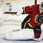 
              Calgary Flames goalie Karri Ramo, from Finland, lets in the tying goal during the second period of Game 4 of NHL hockey second-round playoff action against the Anaheim Ducks in Calgary, Alberta, Friday, May 8, 2015. (Jeff McIntosh/The Canadian Press via AP) MANDATORY CREDIT
            