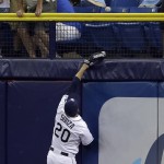               Tampa Bay Rays right fielder Steven Souza Jr. climbs the wall but can't reach a home run by Toronto Blue Jays' Dioner Navarro during the fifth inning of a baseball game Tuesday, June 23, 2015, in St. Petersburg, Fla.  (AP Photo/Chris O'Meara)
            