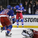 
              New York Rangers center Derek Stepan (21) reacts after scoring the winning goal against the Washington Capitals in overtime of Game 7 of the Eastern Conference semifinals during the NHL hockey Stanley Cup playoffs, Wednesday, May 13, 2015, in New York. The Rangers won 2-1. (AP Photo/Kathy Willens)
            